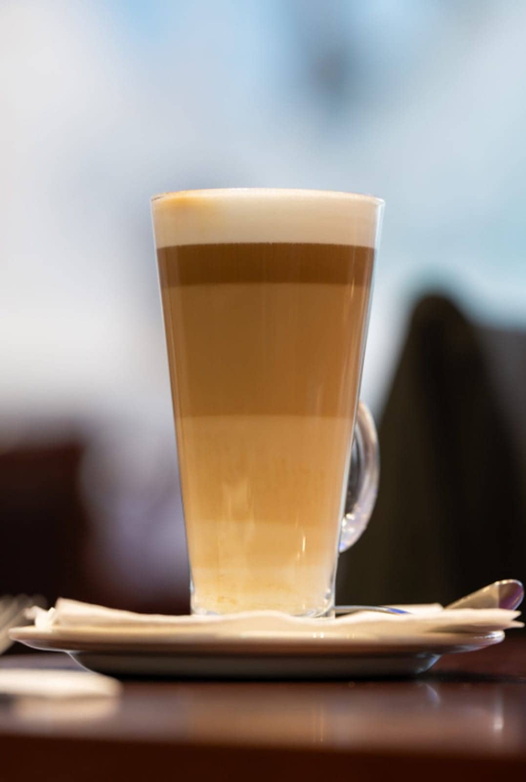 A tall caffè latte in a glass