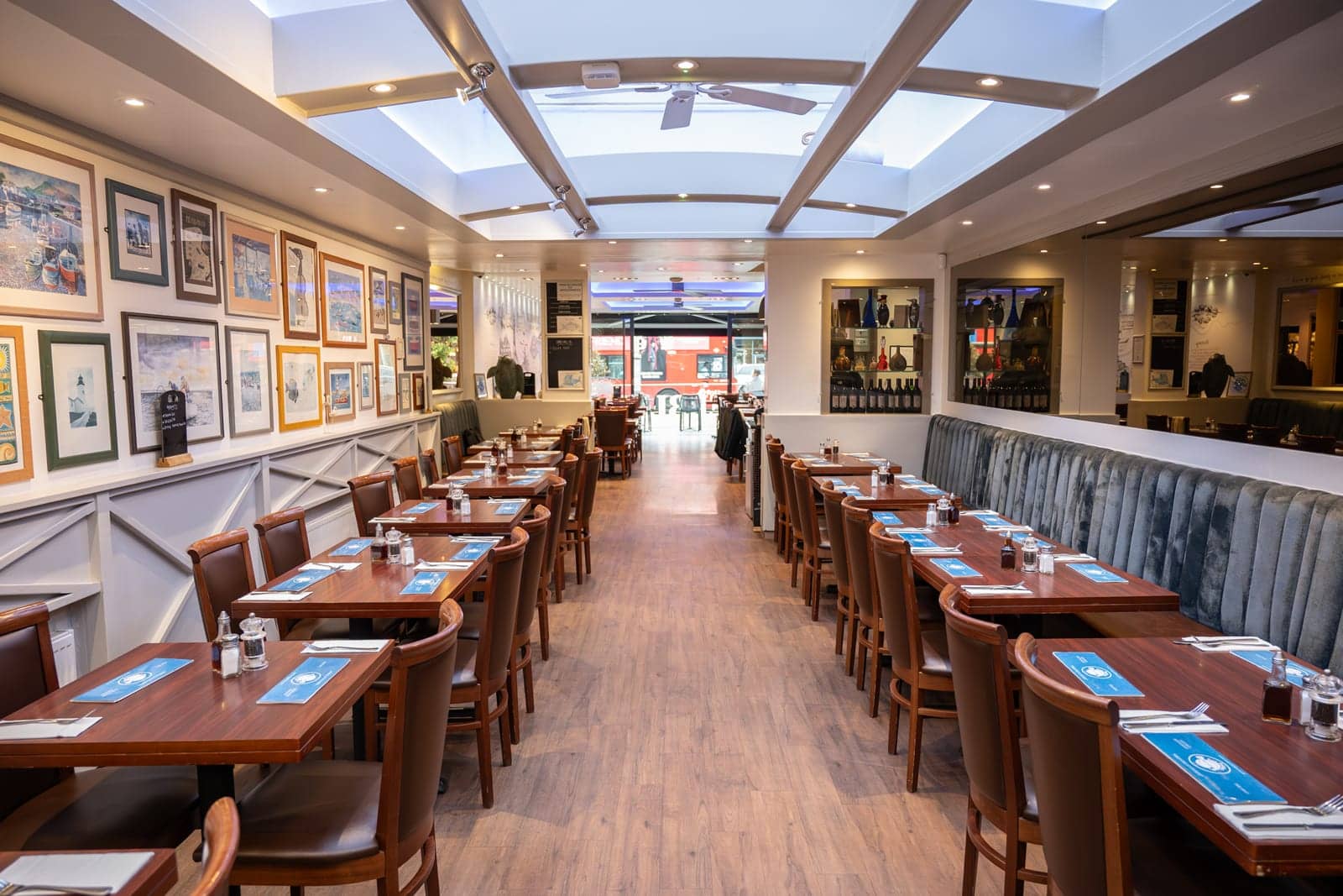 Evening view of the dining room with its blue-lit ceiling