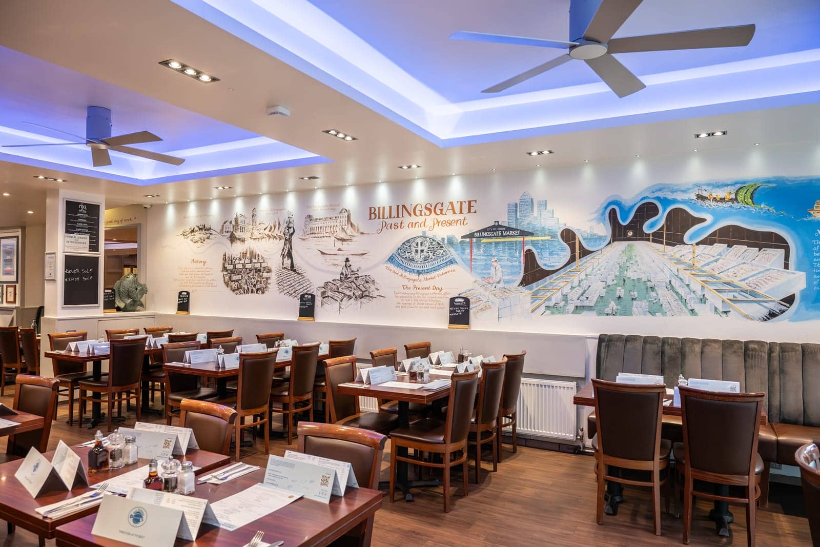 Dining room with the hand-drawn Billingsgate mural along the wall