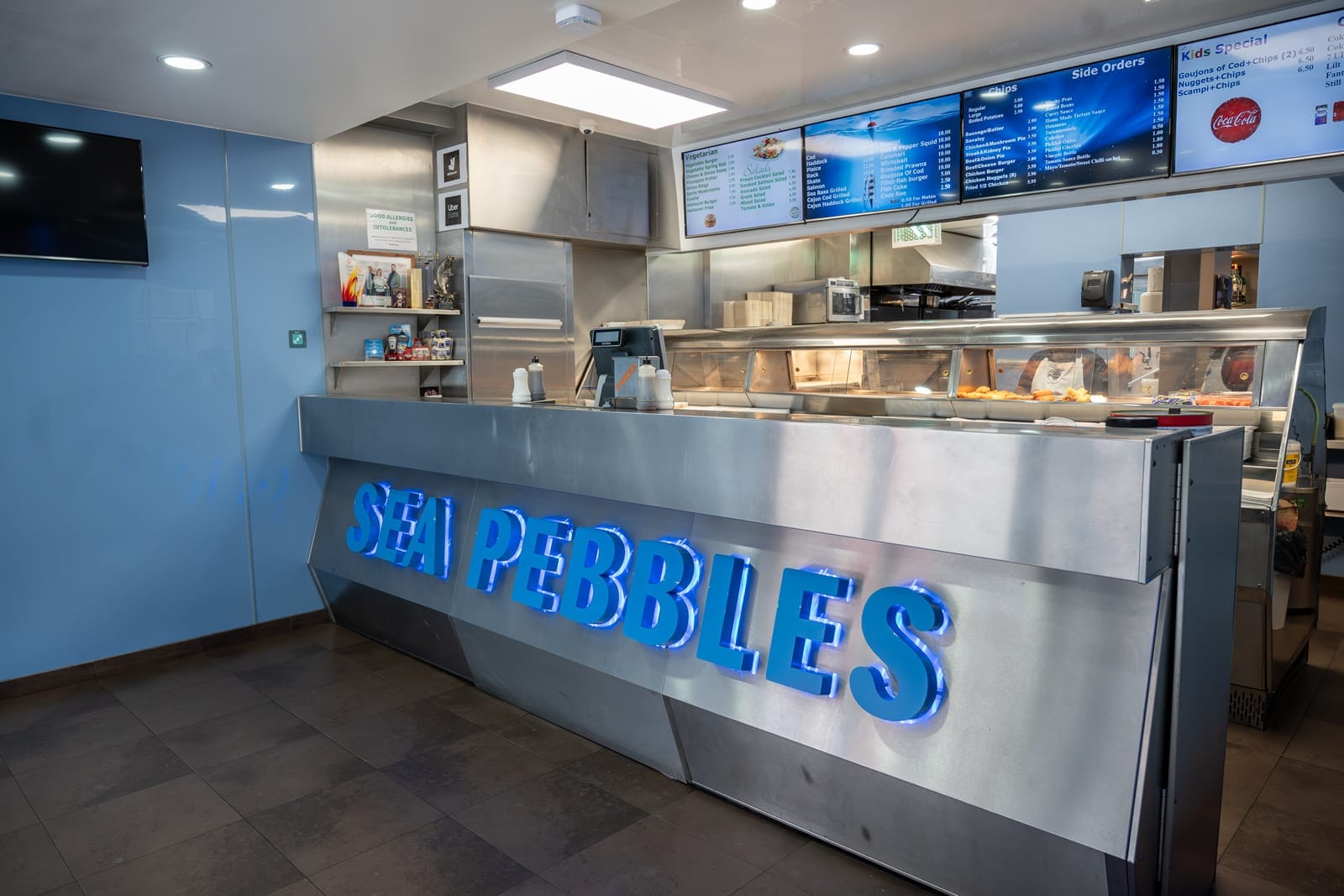 The Sea Pebbles takeaway counter with the heated display and menu boards