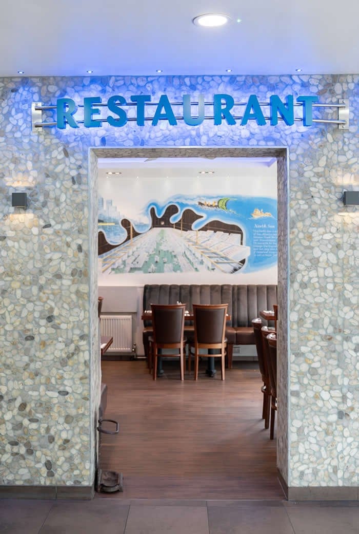 The pebble-clad entrance to the Sea Pebbles restaurant